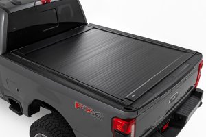 Ford F-250 Super Duty Manual Retractable Bed Cover - Rough Country - Heavy-Duty Aluminum with Smooth Spring-Assisted Retraction - Matte Black - '17-'26